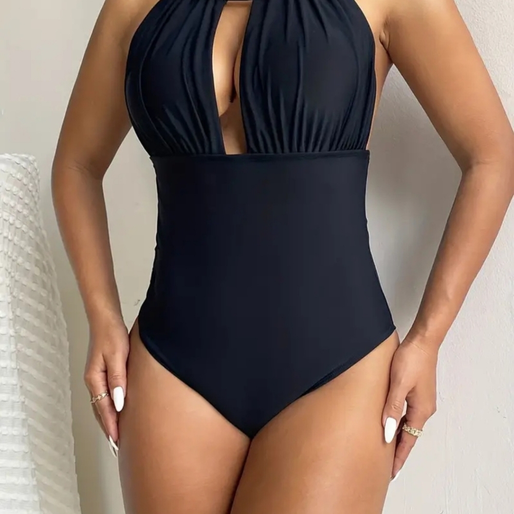 Pair of one piece black swimsuits